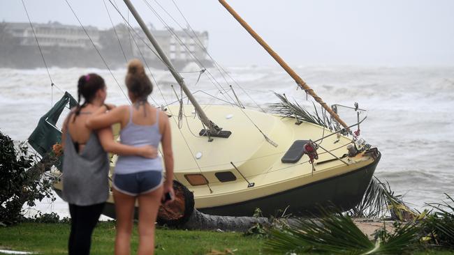 A boat washed ashore at Airlie Beach. Picture: AAP.