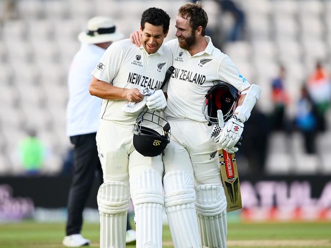 SOUTHAMPTON, ENGLAND - JUNE 23: Kane Williamson and Ross Taylor of New Zealand celebrate victory as they walk off on  the Reserve Day of the ICC World Test Championship Final between India and New Zealand at The Hampshire Bowl on June 23, 2021 in Southampton, England. (Photo by Alex Davidson/Getty Images)