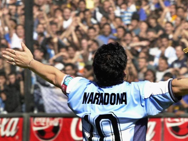 Argentinian football star Diego Maradona greets the public in the "La Bombonera" stadium. Picture: AFP