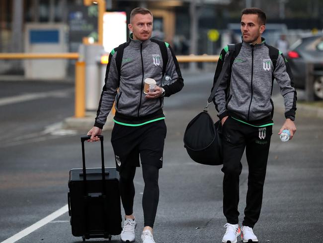 MELBOURNE, AUSTRALIA - JULY 11: Besart Berisha of Western United (L) and teammate Steven Lustica are seen preparing to board a bus to travel to Melbourne Airport at AAMI Park on July 11, 2020 in Melbourne, Australia. Football Federation Australia confirmed on Thursday that it had officially received an exemption under the NSW Public Health Order for the players and high performance staff of Melbourne City FC, Melbourne Victory and Western United FC to travel to NSW to complete the Hyundai A-League 2019/20 season. (Photo by Graham Denholm/Getty Images)