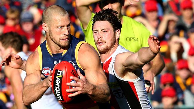 AFL - Adelaide Crows v Saints at Adelaide Oval. Scott Thompson about to get tackled by Jack Steven. Photo Sarah Reed.