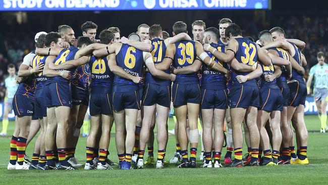 Crows players huddle before the start of the third quarter against the Giants. Jake Kelly says the side is preparing for a tought trip to Perth. Picture Sarah Reed