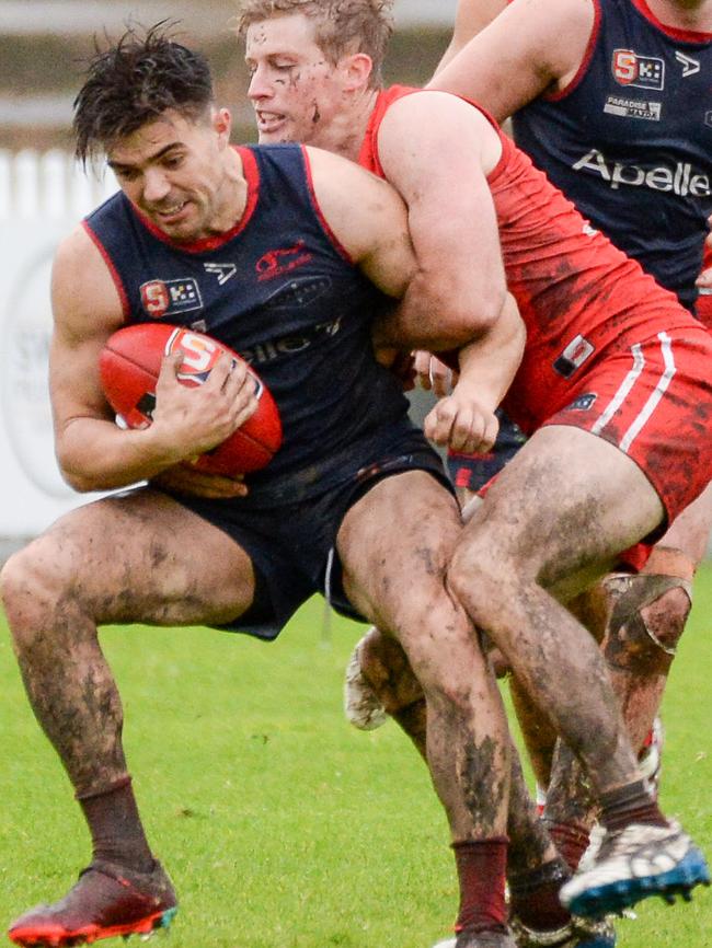 Norwood’s Nik Rokahr is tackled strongly by North Adelaide’s Harrison Wigg at Prospect Oval. Picture: Brenton Edwards.