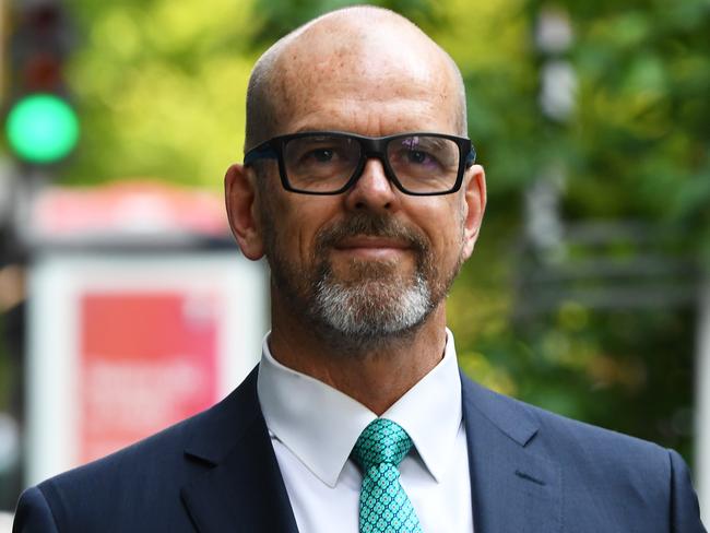 Former Victoria Police Chief Commissioner Simon Overland arrives to the Royal Commission into the Management of Police Informants at the Fair Work Commission in Melbourne, Tuesday, December 17, 2019. (AAP Image/James Ross) NO ARCHIVING