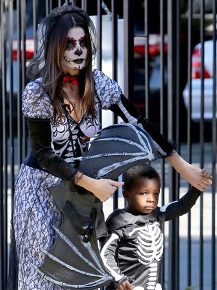 Sandra Bullock takes Louis to a Halloween party in 2014.