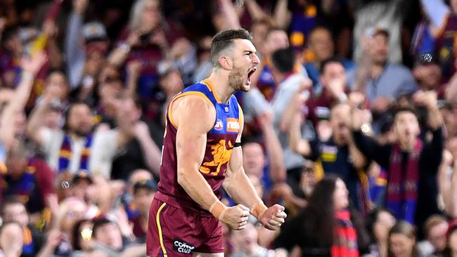 Lions fans celebrate a Daniel McStay goal at the Gabba last season. Picture: Getty Images