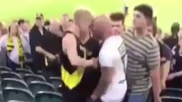 The AFL's season opener has been marred by an ugly brawl between footy fans.