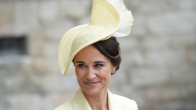 Pippa Middleton wears the Claire Mischevani ‘Alais’ coat in a bespoke yellow shade with a matching headpiece by Jane Taylor. Picture: Getty Images