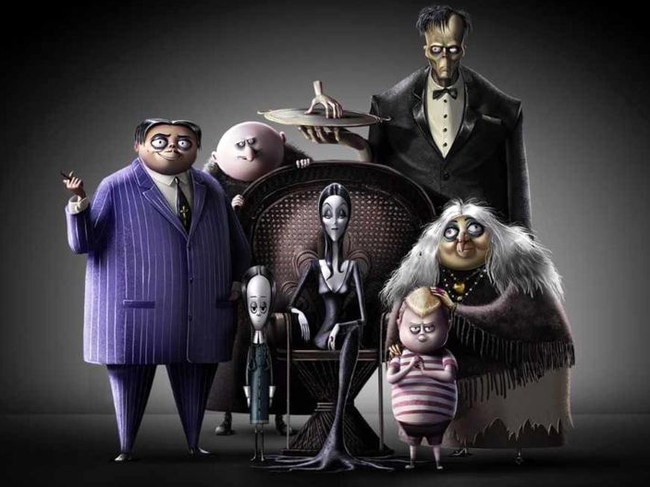 Morticia (centre, voiced by Charlize Theron) and Gomez (left, voiced by Oscar Isaac) in a scene from the movie The Addams Family.