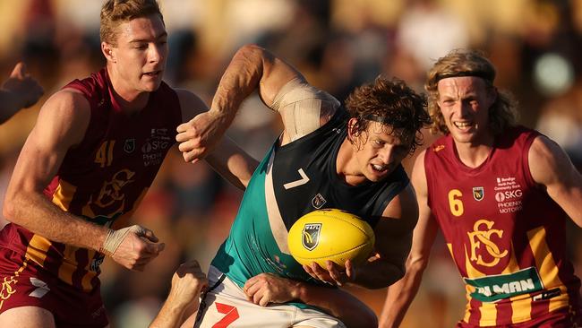 Nat Fyfe looks to handball during his WAFL cameo.