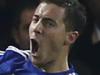 Chelsea's Eden Hazard, right, leaps and punches the air as he celebrates after scoring the opening goal of the game during the English Premier League soccer match between Chelsea and Tottenham Hotspur at Stamford Bridge stadium in London, Wednesday, Dec. 3, 2014. (AP Photo/Alastair Grant)