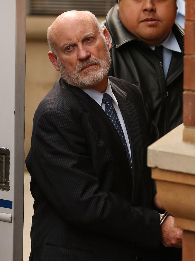 Former Labor MP Ian Macdonald is led out of King St court after being sentenced to 10 years jail.