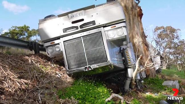 A truck driver was lucky to walk away without a scratch after his truck rolled at Yankalilla. Picture: 7 News