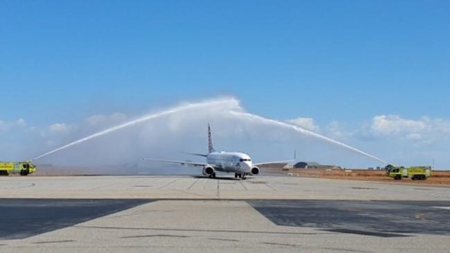 The traditional water arch performed by Aviation Rescue Firefighters welcomes Essendon and Richmond to Darwin.