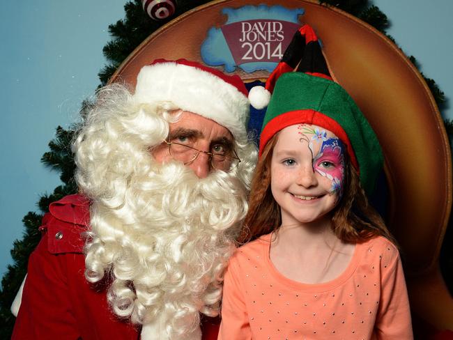 will Christmas cheer extent to retailers ... Eight-year-old Darcy callanan meets Santa at David Jones’ Bourke Street store in Melbourne. Picture: Andrew Batsch