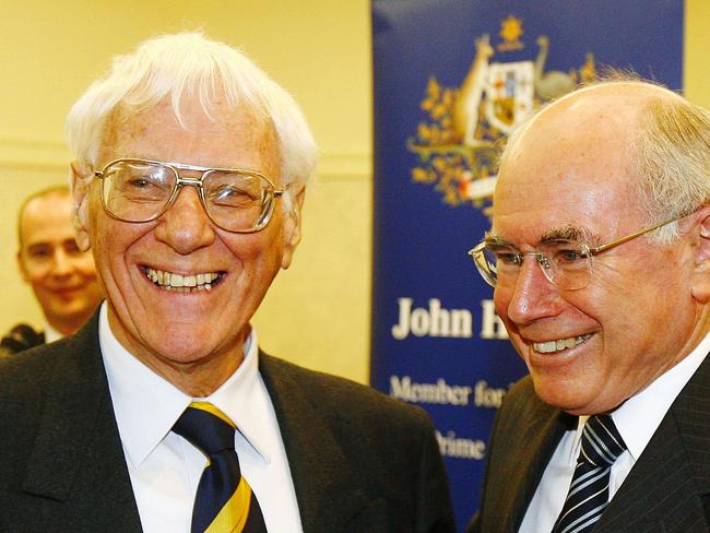 Dr John Knight aka Dr James Wright, with Prime MInister John Howard in 2006. Picture: Dave Swift