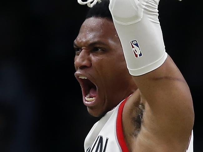 Houston Rockets' Russell Westbrook (0) dunks in front of teammate James Harden (13) during the second half of the team's NBA basketball game against the Boston Celtics in Boston, Saturday, Feb. 29, 2020. (AP Photo/Michael Dwyer)