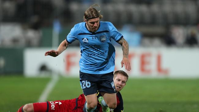 Sydney FC’s Luke Brattan gets the better of Adelaide United’s Ryan Kitto in the Sky Blues’ 2-1 semi-final win over the Reds. Picture: Mark Metcalfe/Getty Images