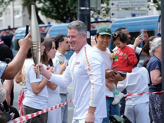 PARIS FRANCE 2024 OLYMPIC GAMES. Nine CEO Mike Sneesby carries the Paris Olympics torch in the Olympic torch relay. Pic: JACQUELIN MAGNAY