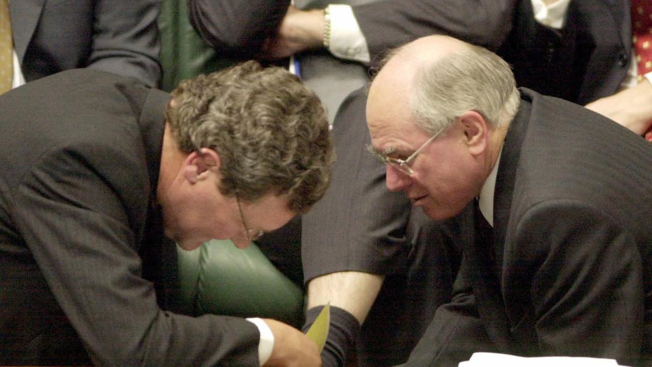 The-then foreign affairs minister Alexander Downer (left) with prime minister John Howard during federal parliamentary question time in August, 2002.