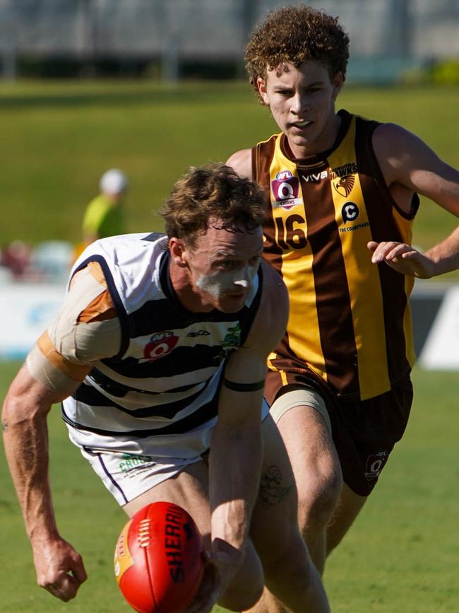 Port's Harvey Moore and Manunda's Joshua Welsford. AFL Cairns: Manunda Hawks v Port Douglas Crocs at Cazalys Stadium. Picture: Nuno Avendano