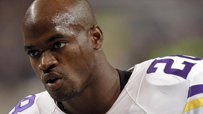 FILE - In this Sept. 7, 2014, file photo, Minnesota Vikings running back Adrian Peterson warms up for an NFL football game against the St. Louis Rams in St. Louis. The Vikings benched Peterson for Sunday's game after his attorney said he had been indicted by a Texas grand jury on a charge of child abuse. Attorney Rusty Hardin says the charge accuses Peterson of using a branch, or switch, to spank his son. He says Peterson has cooperated with authorities and "used his judgment as a parent to discipline his son." Hardin says Peterson regrets the incident but never intended to harm the boy. (AP Photo/Tom Gannam, File)