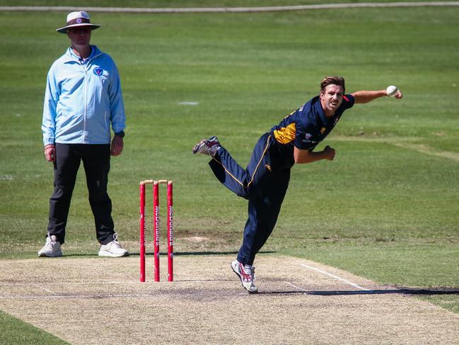 University bowler Devlin Malone sends down a delivery. Picture: Kate Zarifeh