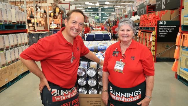 John Gillam with 25-year employee Lyn French at the opening of a new Bunnings warehouse in Cairns.