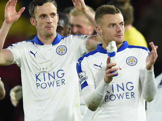 Leicester City's English defender Danny Simpson (L), Leicester City's Welsh midfielder Andy King (C) and Leicester City's English striker Jamie Vardy appluad the fans following the English Premier League football match between Watford and Leicester City at Vicarage Road Stadium in Watford, north of London on March 5, 2016. Leicester won the match 1-0. / AFP / OLLY GREENWOOD / RESTRICTED TO EDITORIAL USE. No use with unauthorized audio, video, data, fixture lists, club/league logos or 'live' services. Online in-match use limited to 75 images, no video emulation. No use in betting, games or single club/league/player publications. /