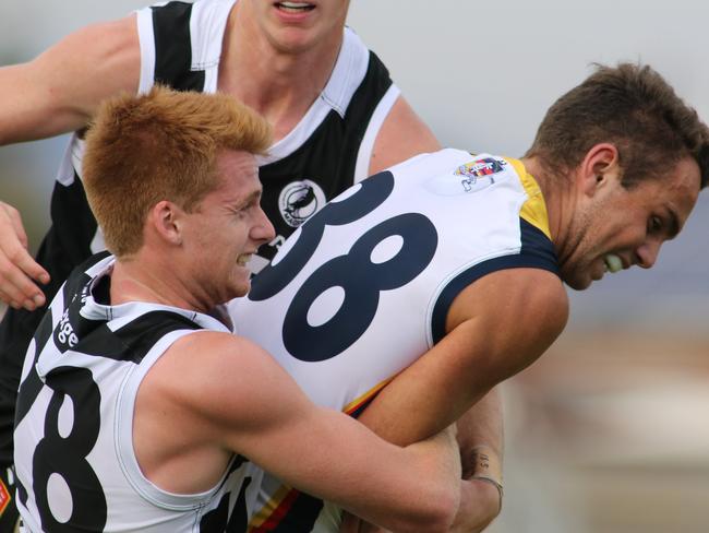 ADV SPORT :  SANFL: Port Adelaide v Adelaide at Alberton Oval, Port's Willem Drew tackles Crow's Lachlan Sholl.18/5/2019     AAP Image/Russell Millard)