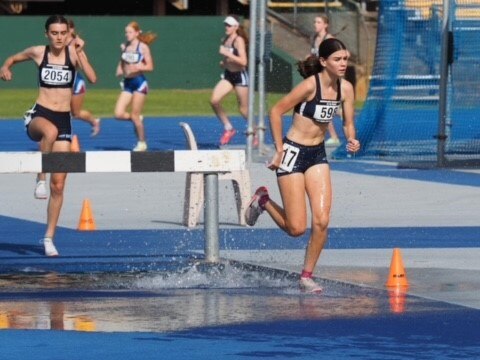 Zara Moore and Selwyn Russell of Brisbane State High School in the Steeple Chase event.