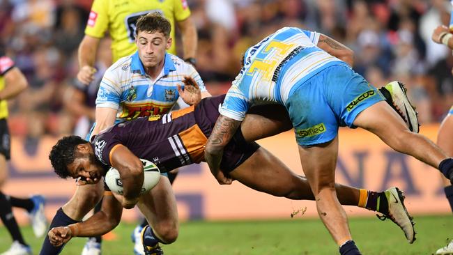 Max King and Kevin Proctor tackle Broncos winger Jonus Pearson. Picture: AAP Image