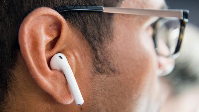 AirPods look like they’ll fall out of your ear but they don’t. Picture: AFP PHOTO / Josh Edelson