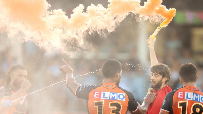 George with the lit flare on the field. Picture: Mark Kolbe/Getty Images)