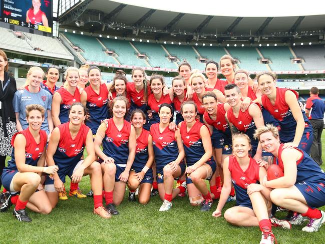 MELBOURNE, VICTORIA - MAY 22: Daisy Pearce and her Melbourne teammates pose for a team photo after winning the 2016 AFL Womens match between the Melbourne Demons and the Brisbane Lions at the Melbourne Cricket Ground on May 22, 2016 in Melbourne, Australia. (Photo by Scott Barbour/AFL Media/Getty Images)