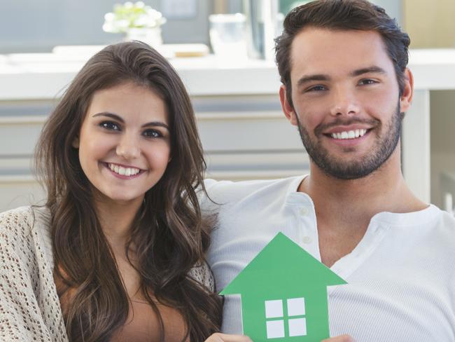 A young couple who have bought their first home and have a mortgage. They are working hard to pay down their home loan. Picture: iStock.