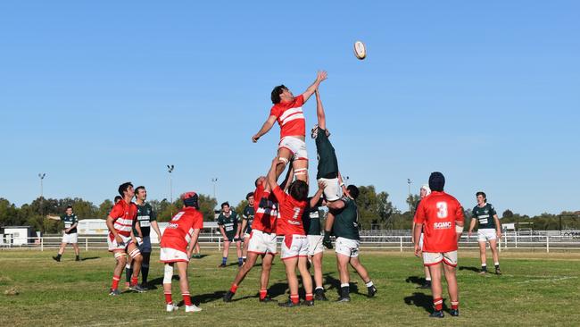 Spectators cheer on as they watch the B Grade St George vs Condamine match at the Roma Rugby Races at Bassett Park. Picture: Chloe Cufflin.