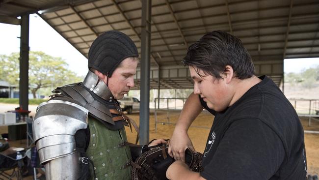 Kyle Weblin (left) is made battle ready with help from Kael Yamasita at the Buhurt, Beer and BBQ event. Picture: Kevin Farmer