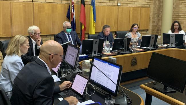 Crs Tony Judge, Julie Sechi and Rodger Pryce to the left with mayor Paul Amos, deputy mayor Sally Townley and Cr Tegan Swan to the right at the first meeting of the new Coffs Harbour City Council in February. Picture: Janine Watson