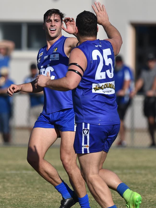 Elton celebrates with Fevola.