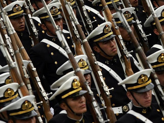 Bolivian navy soldiers take part in a parade during celebrations for the 127th anniversary of the War of Pacific in which Bolivia lost its coastal access to neighbor Chile, Thursday, March 23, 2006. The government of Chilean President Michelle Bachelet said on Wednesday it wants to renew diplomatic relations with Bolivia, but not if its South American neighbor insists on first resolving its long-standing demand for access to the Pacific Ocean. (AP Photo/Dado Galdieri)