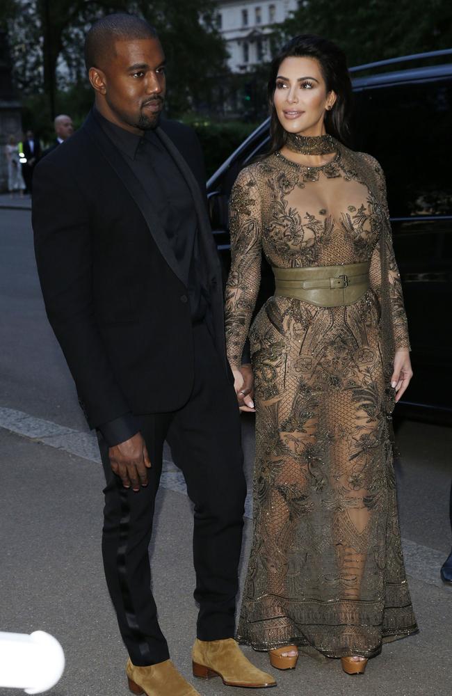 Poor Kanye — that’s a damn fine suit but nobody’s looking at him. Picture: Rex Features / Splash News