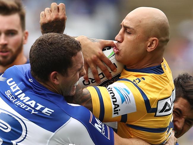 Blake Ferguson of the Eels is tackled by the Bulldogs defence during the Round 2 NRL match between the Canterbury Bulldogs and the Parramatta Eels at ANZ Stadium, Sydney, Sunday, March 24, 2019. (AAP Image/Brendon Thorne) NO ARCHIVING, EDITORIAL USE ONLY