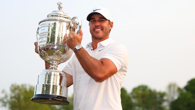 ROCHESTER, NEW YORK - MAY 21: Brooks Koepka of the United States celebrates with the Wanamaker Trophy after winning the 2023 PGA Championship at Oak Hill Country Club on May 21, 2023 in Rochester, New York.   Andrew Redington/Getty Images/AFP (Photo by Andrew Redington / GETTY IMAGES NORTH AMERICA / Getty Images via AFP)