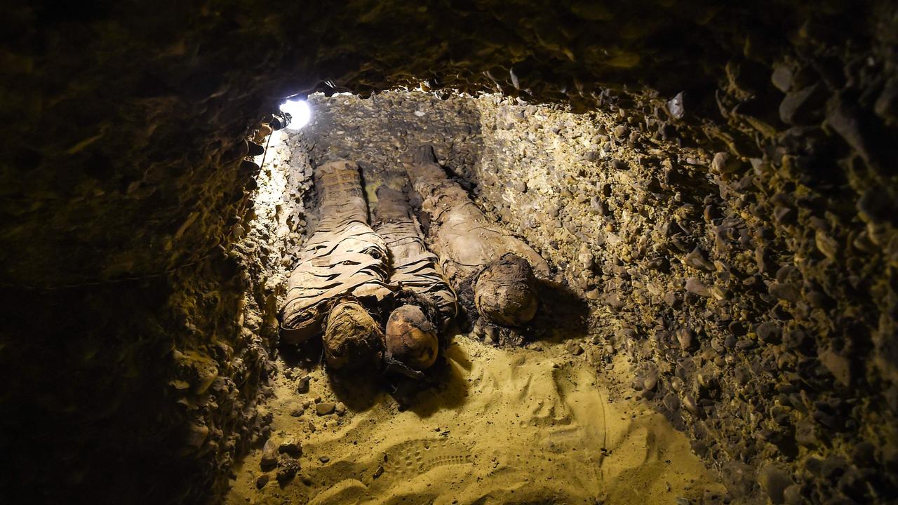Minya University's Archaeological Studies Research Centre found upon a collection of Ptolemaic burial chambers engraved in rock and filled with a large number of mummies of different sizes and genders. Picture: Mohamed el-Shahed