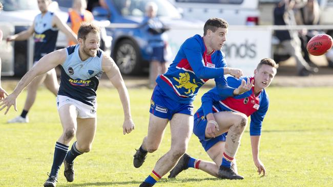 Huonville’s Callum Rawson handballs out of trouble during the game against Lindisfarne. Picture: Chris Kidd