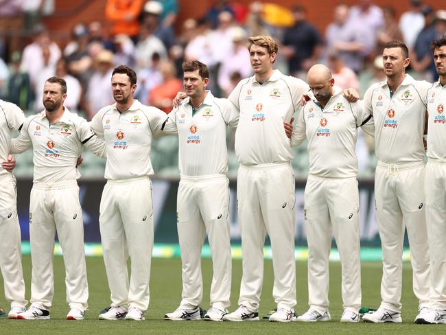 ADELAIDE, AUSTRALIA - DECEMBER 17: Members of the Australian team stand during the signing of the national anthem during day one of the First Test match between Australia and India at Adelaide Oval on December 17, 2020 in Adelaide, Australia. (Photo by Cameron Spencer/Getty Images)