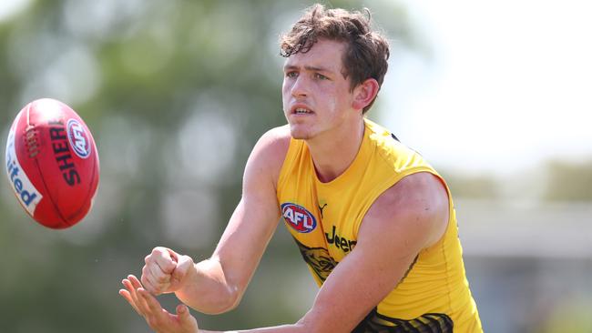 GOLD COAST, AUSTRALIA - JANUARY 30: Riley Collier-Dawkins handballs during a Richmond Tigers AFL training session at Southport Sharks on January 30, 2020 in Gold Coast, Australia. (Photo by Chris Hyde/Getty Images)