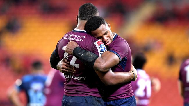 BRISBANE, AUSTRALIA - JUNE 07: Samu Kerevi and Filipo Daugunu of the Reds celebrate victory during the round 17 Super Rugby match between the Reds and the Blues at Suncorp Stadium on June 07, 2019 in Brisbane, Australia. (Photo by Bradley Kanaris/Getty Images)