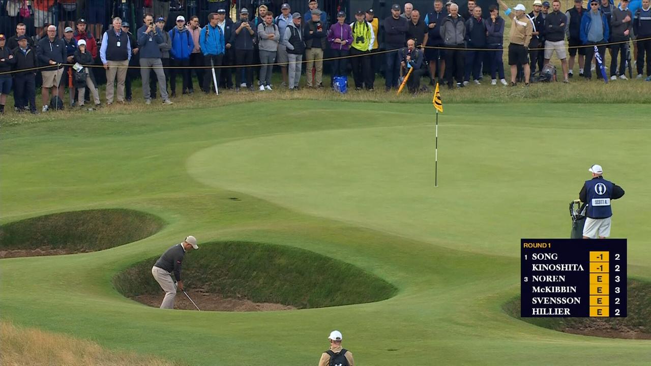 Adam Scott chips in from the bunker for birdie on the par four 1st.